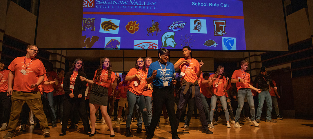 A group of young adults standing in a row